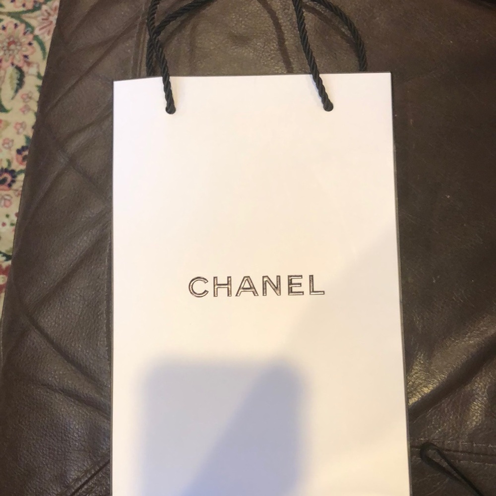 Chanel shopping bag 9 1/2 by 6 with 2 Handles.